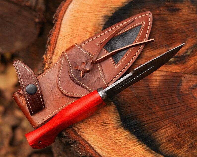 Damascus steel hunting knife by cskforged with a sharp blade and textured handle, designed for outdoor hunting activities.
