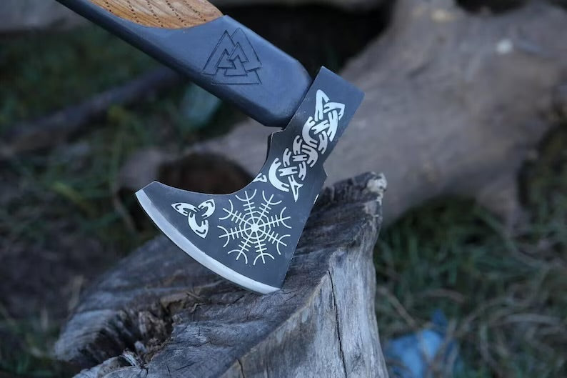 Handmade carbon steel Viking axe with leather sheath, ideal for hunting, outdoor activities, and camping by Knives Gear Garage.