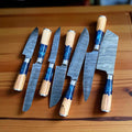 Handmade Damascus steel chef knife with resin and olivewood handle, steel bolster, and leather sheath from Knives Gear Garage kitchen knife set.