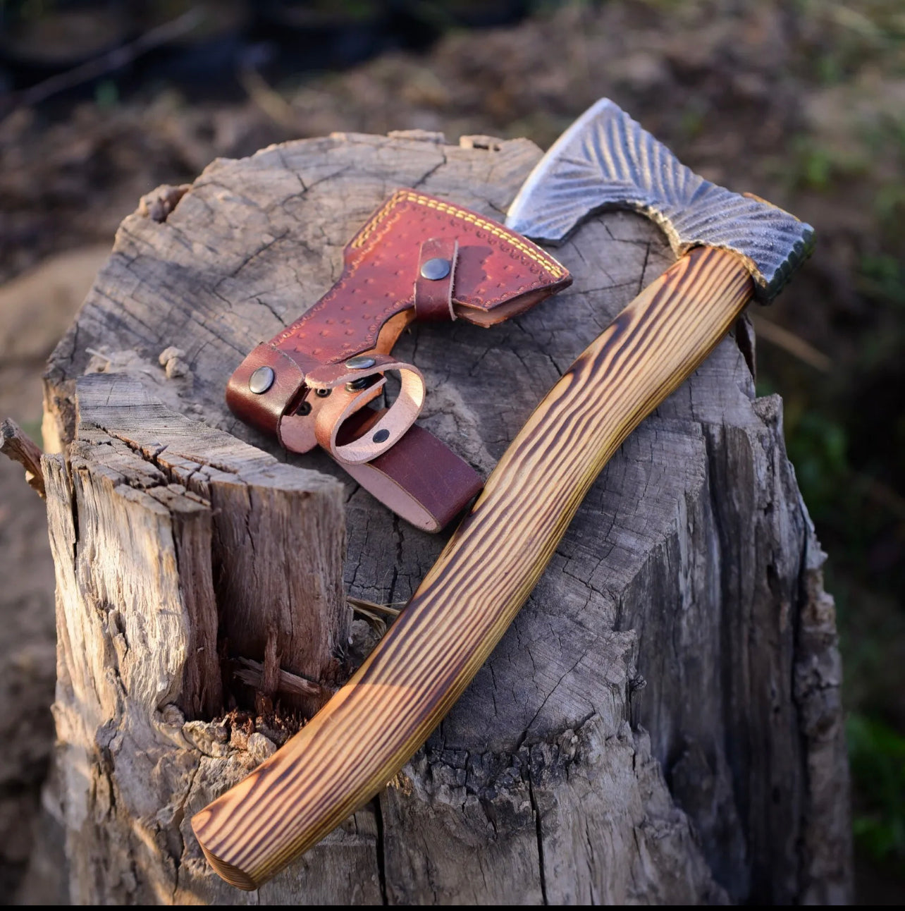 Handmade carbon steel Viking battle axe with wooden handle, detailed craftsmanship, and traditional Norse design.