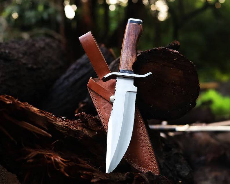 Handcrafted J2 steel Bowie knife with 13-inch bone handle, steel guard, and leather sheath, made by Knives Gear Garage.