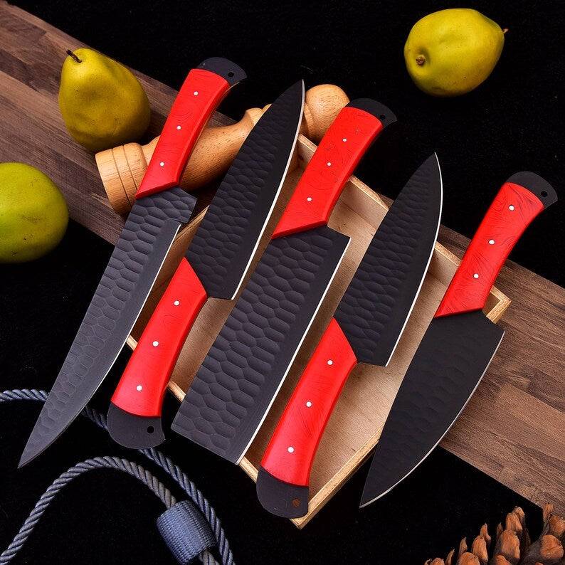 Set of stainless steel kitchen knives from Knives Gear Garage, including chef, bread, and paring knives on a wooden countertop.