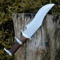 Custom handmade J2 steel Bowie knife with rosewood handle, steel guard, and leather sheath from Knives Gear Garage.