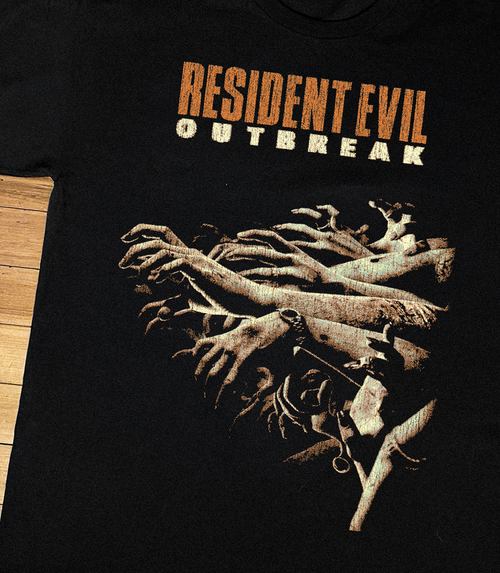 Black Resident Evil Outbreak PS2 T-shirt by Parallel featuring a close-up image of the game logo and design details.