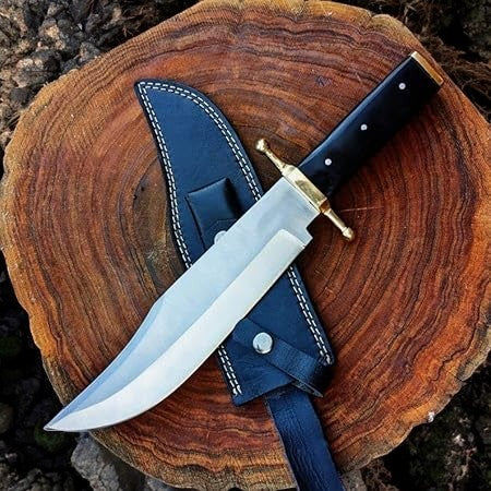Handmade Bowie knife with D2 steel blade and buffalo horn handle, detailed close-up showing craftsmanship and blade edge.