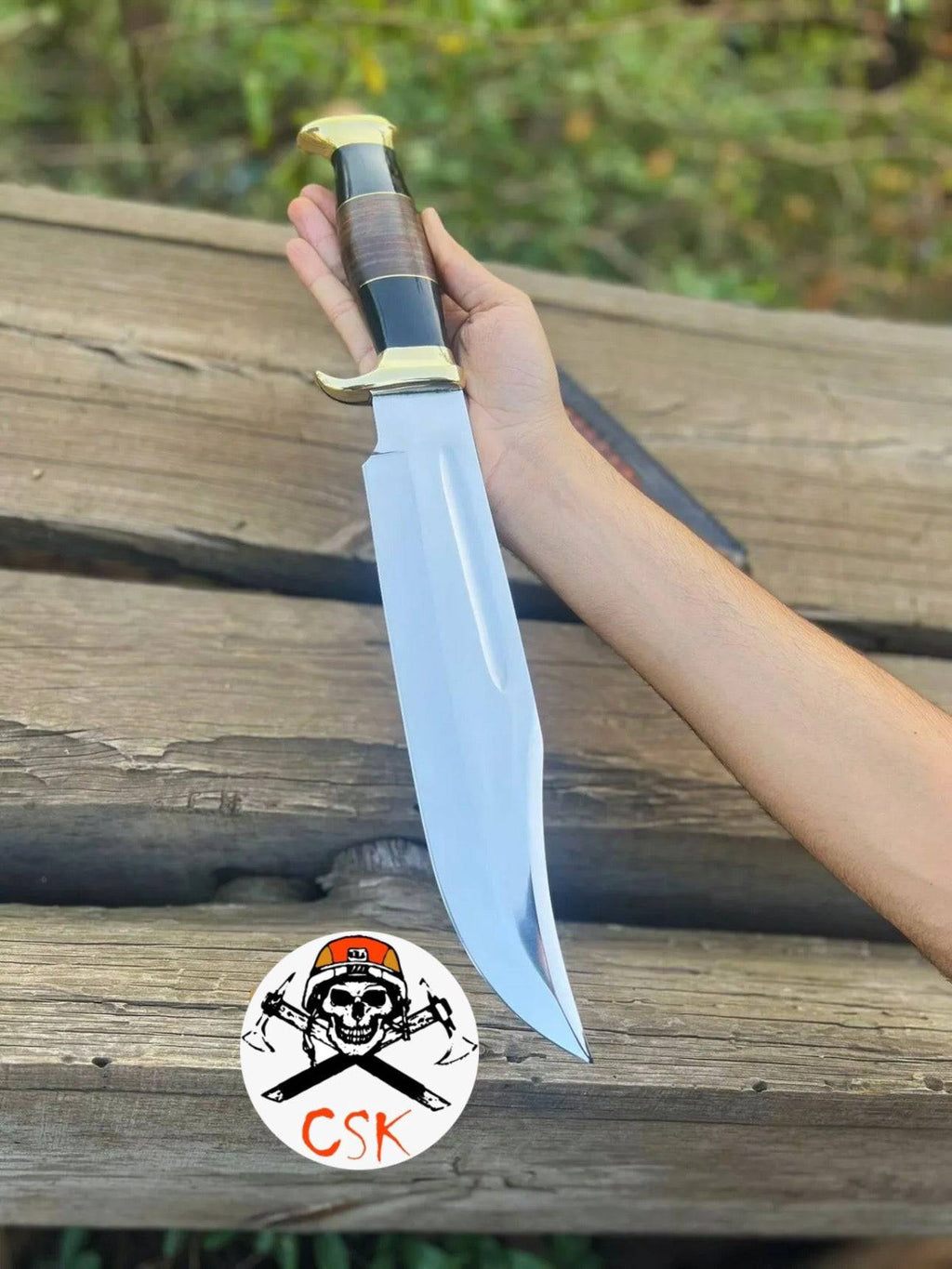 Crocodile Dundee Bowie Knife by cskforged, a hunting knife with a sharp blade and detailed handle, displayed in a close-up shot.