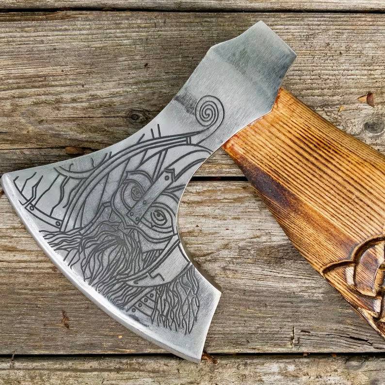 Viking axe lover with wooden handle and metal blade, displayed on a wooden surface, showcasing detailed craftsmanship.