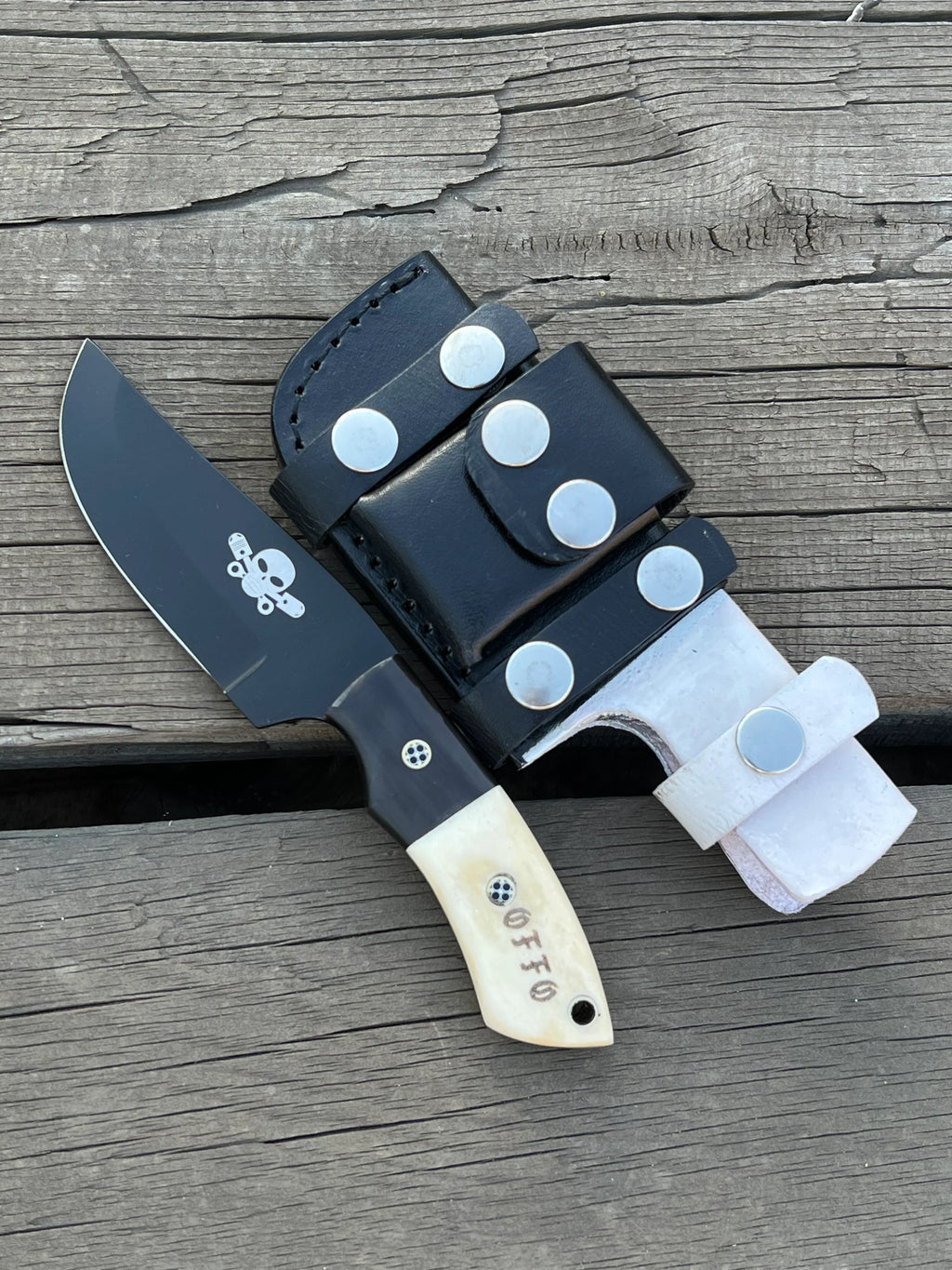 Full tang custom handmade hunting knife with black coated J2 steel blade from Knives Gear Garage, detailed close-up image.