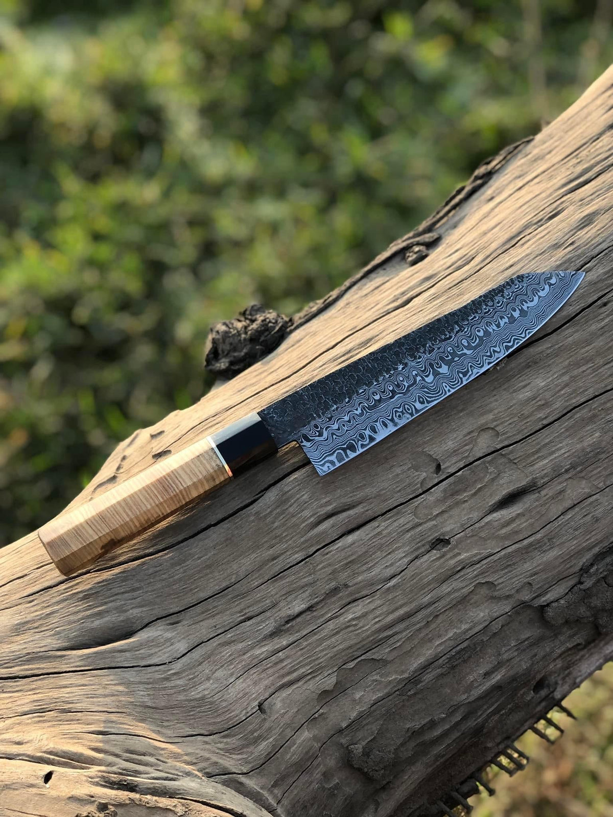 Custom handmade 13-inch Damascus steel chef knife with brass guard and olive wood handle, includes leather sheath.