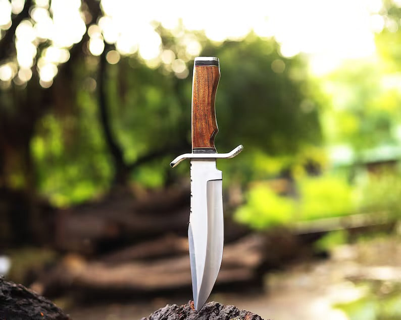 Custom handmade J2 steel Bowie knife with 13-inch bone handle, steel guard, and leather sheath from Knives Gear Garage