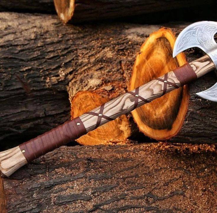 Custom handmade double-blade knife by Knives Gear Garage with engraved D2 steel blades and ash wood handle, includes leather sheath.