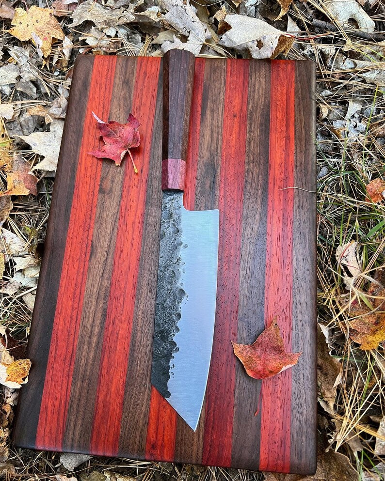 Lightweight chef knife by Knives Gear Garage with a sharp stainless steel blade and ergonomic handle for precise cutting.