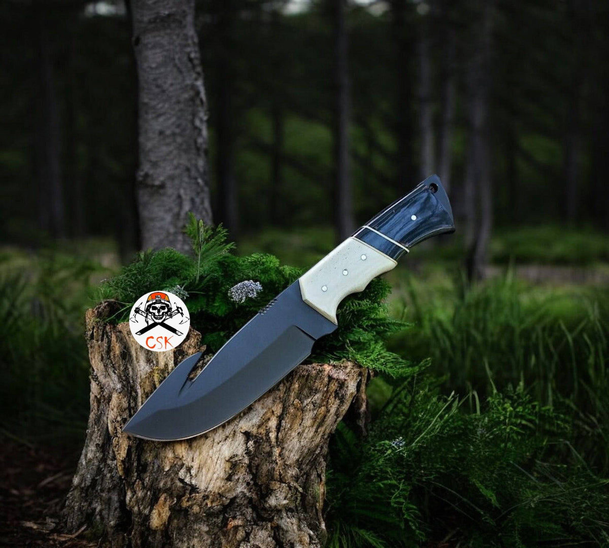 Black and white handle hunting knife by cskforged, outdoor survival tool with sharp blade for hunting and outdoor activities.