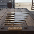 7-piece JW SteelCrafts Damascus kitchen knife set with synthetic stag horn handles, brass bolsters, and full tang forged blades