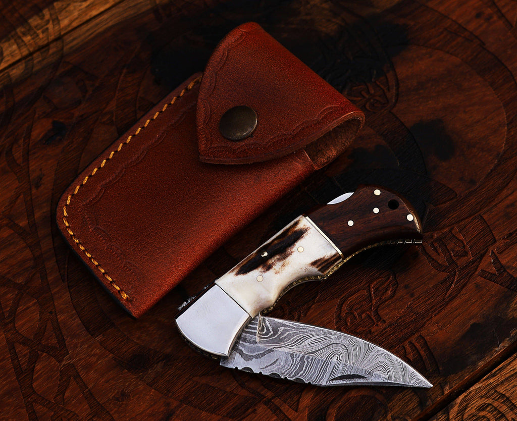 Damascus steel pocket knife with stag and rose wood handle, handcrafted folding knife by CSK Forged.