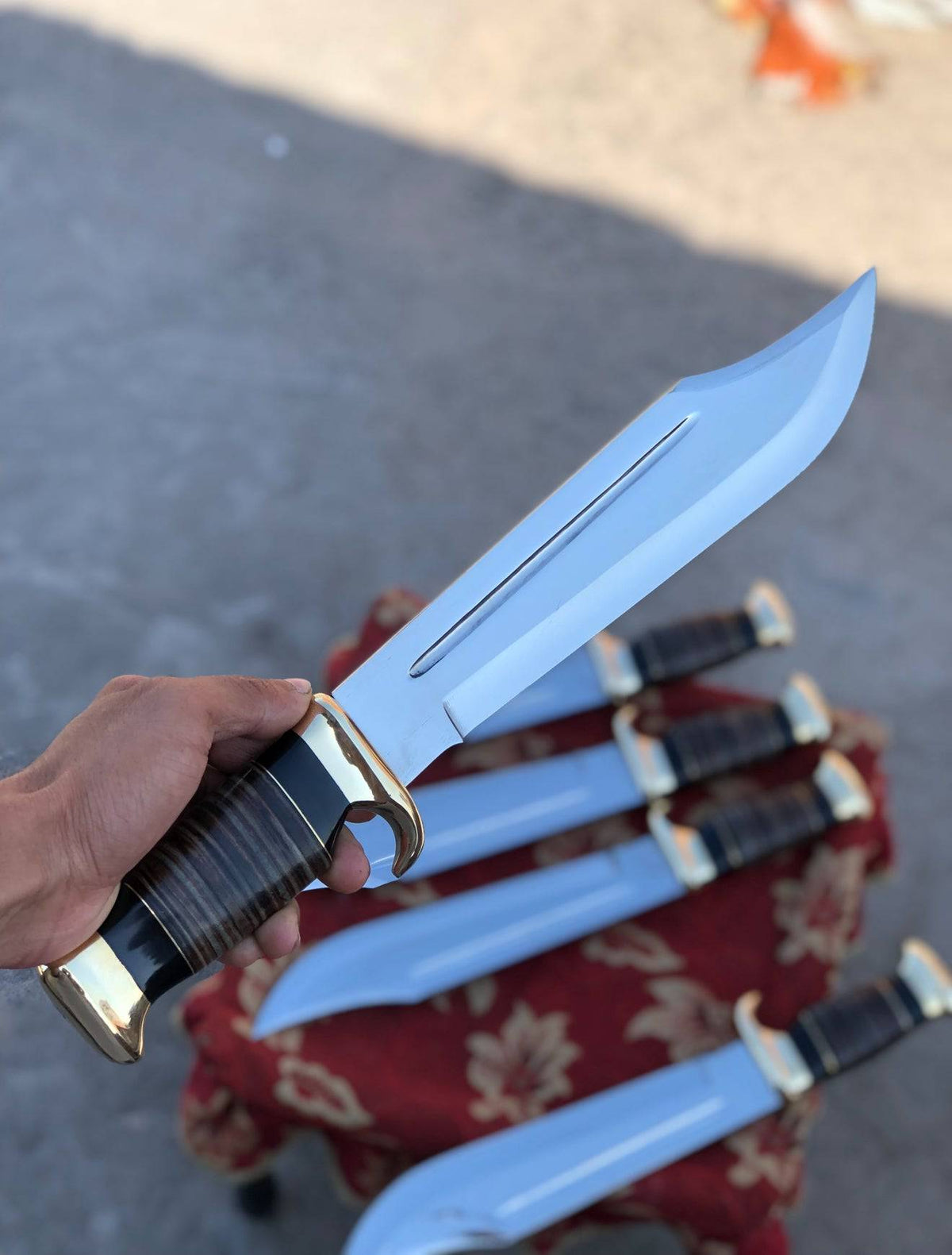 Handmade D2 steel Dundee Bowie knife with buffalo horn handle, leather grip, and sheath, featuring a crocodile Dundee style design.