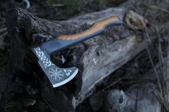 Handmade carbon steel Viking axe with leather sheath, ideal for hunting, outdoor activities, and camping from Knives Gear Garage