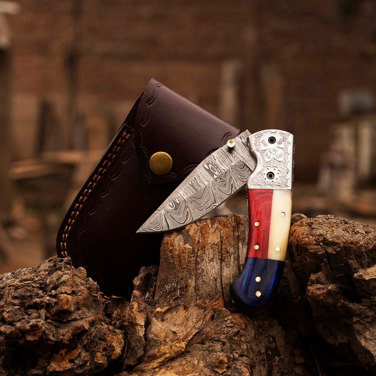 Damascus pocket knife with folding blade, everyday carry knife by Knives Gear Garage, featuring intricate Damascus steel pattern.