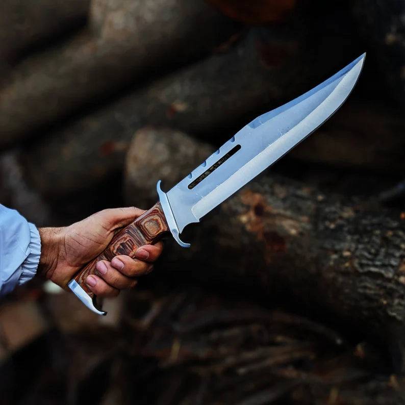 Cskforged Rambo survival knife with D2 steel blade and black handle, designed for outdoor and tactical use.