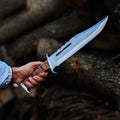 Cskforged Rambo survival knife with D2 steel blade and black handle, designed for outdoor and tactical use.