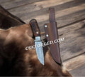 Hand-forged Damascus tactical brawler's knife from cskforged, featuring a sharp hunting knife blade and sturdy handle.