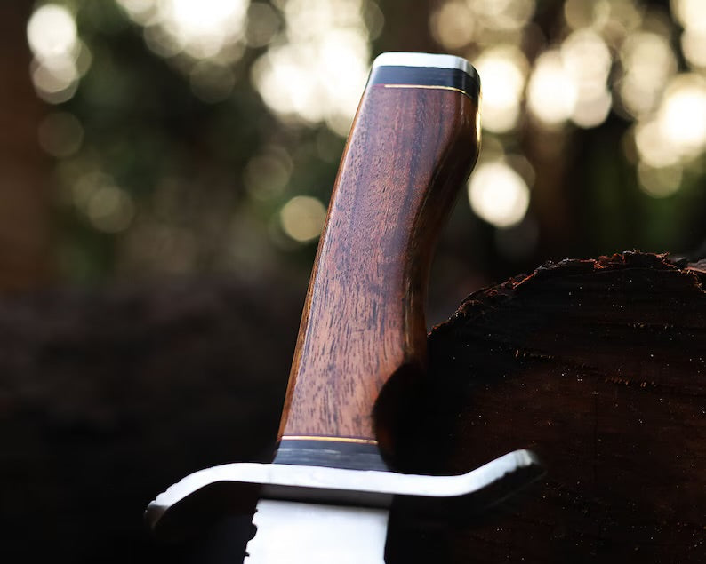 Handcrafted J2 Steel Bowie knife with 13-inch bone handle, steel guard, and leather sheath, showcasing detailed craftsmanship.