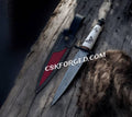 Hand-forged Damascus knight sword with black chrome accents from cskforged, featuring intricate blade details and a rugged battle-ready design.