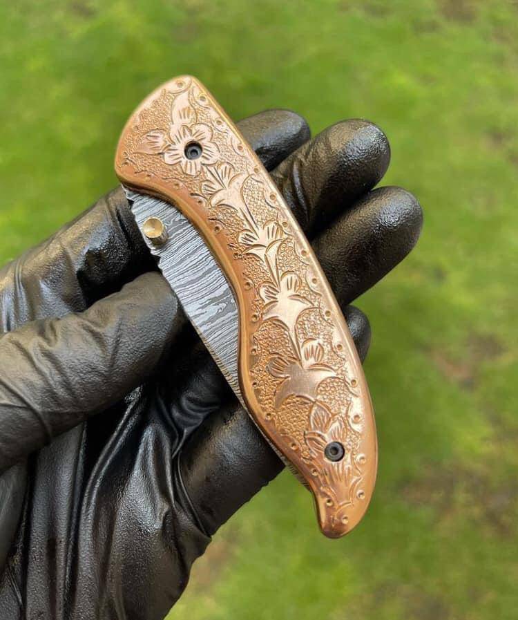 Custom handmade Damascus blade EDC folding pocket knife by cskforged, featuring a detailed Damascus steel handle and sleek design.
