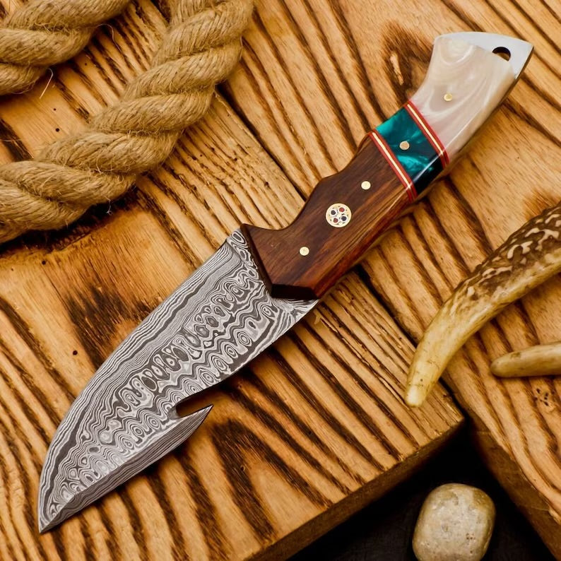 Stainless steel hunting camping knife by Knives Gear Garage with a textured handle and sharp blade for outdoor use