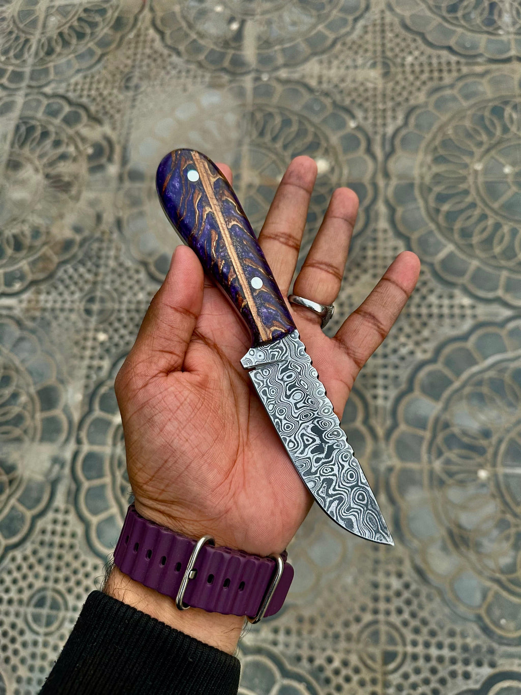 Sharp hunting knife from Knives Gear Garage with a wooden handle and stainless steel blade, ideal for outdoor hunting activities.