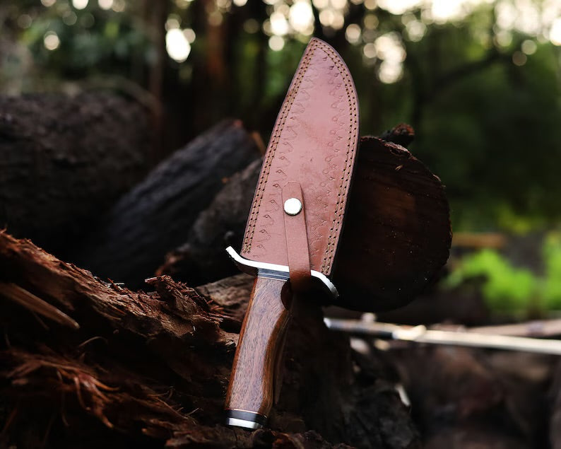 Custom handmade J2 steel Bowie knife with 13-inch bone handle, steel guard, and leather sheath from Knives Gear Garage.