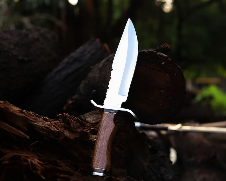Close-up of Knives Gear Garage premium handcrafted J2 steel Bowie knife with 13-inch bone handle, steel guard, and leather sheath.