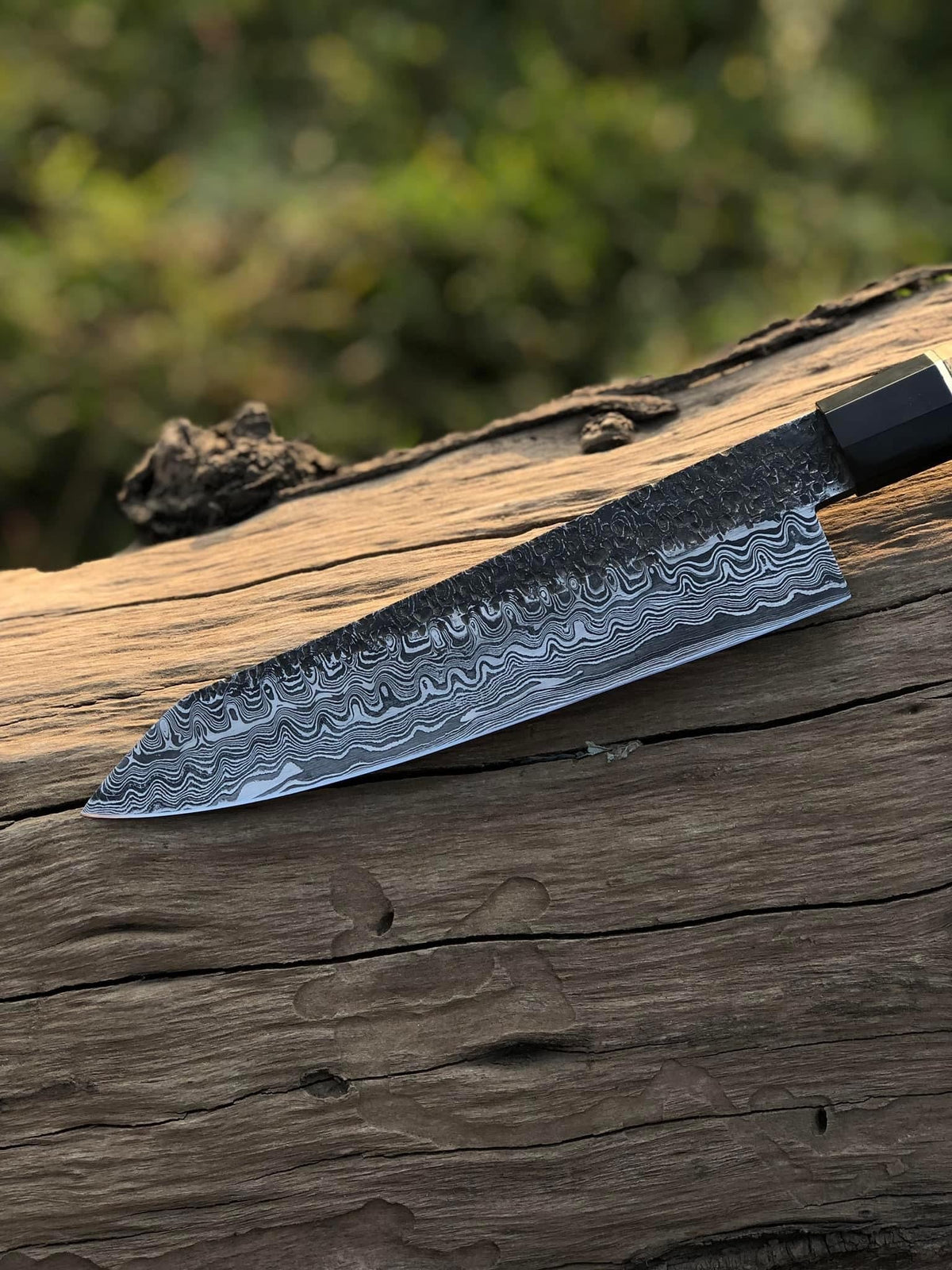 Custom 13-inch Damascus steel chef knife with brass guard and olive wood handle, includes leather sheath by Knives Gear Garage.