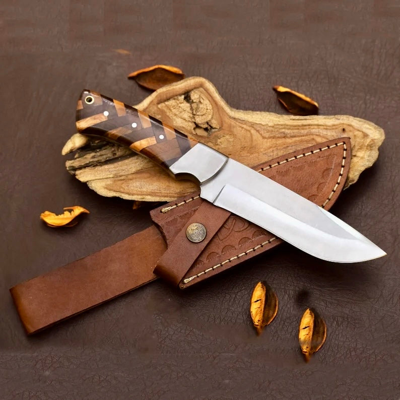 Handmade D2 steel hunting knife with a leather handle and sheath, crafted by Knives Gear Garage.