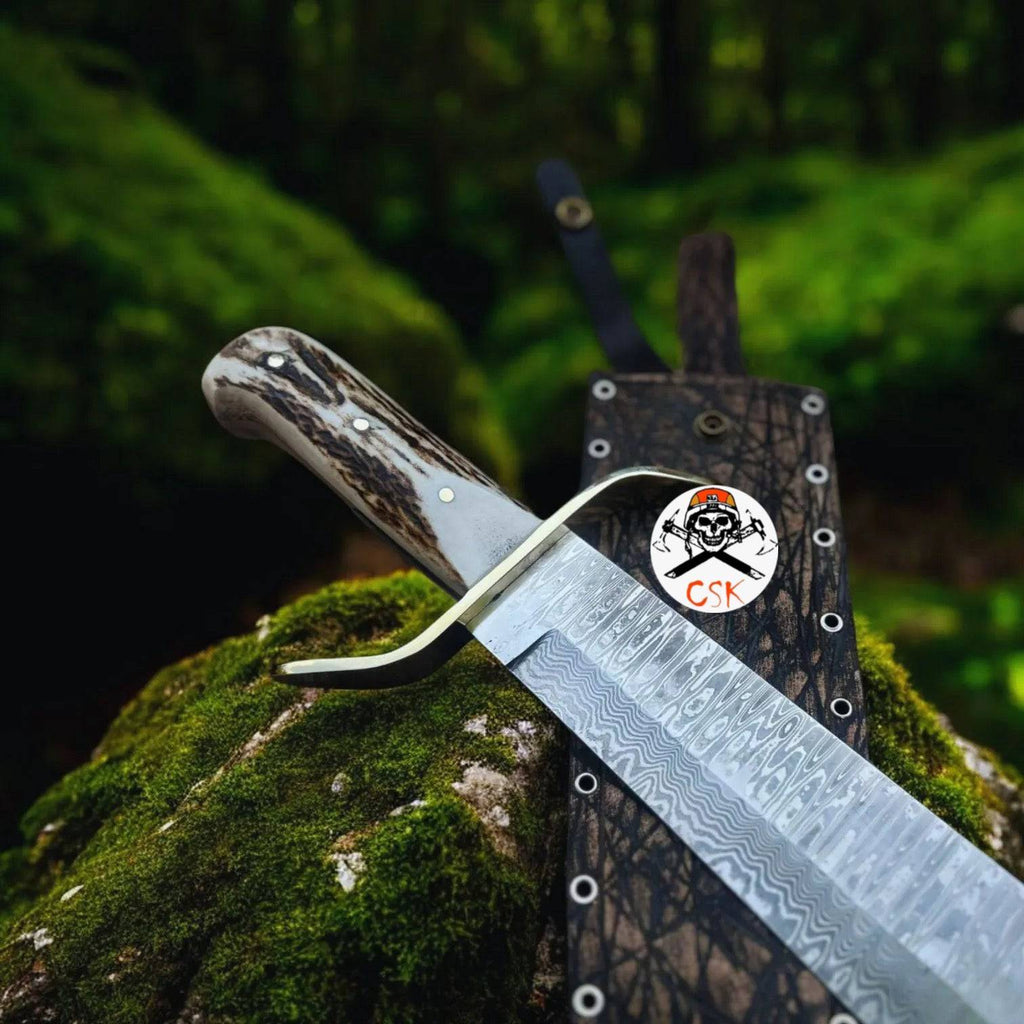 Damascus stag hunting knife by cskforged with custom leather sheath, featuring a detailed Damascus steel blade and stag handle.