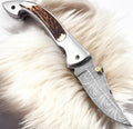 Handmade Damascus pocket knife with stag horn handle and 3-inch blade, crafted by Damascus Knife Store.