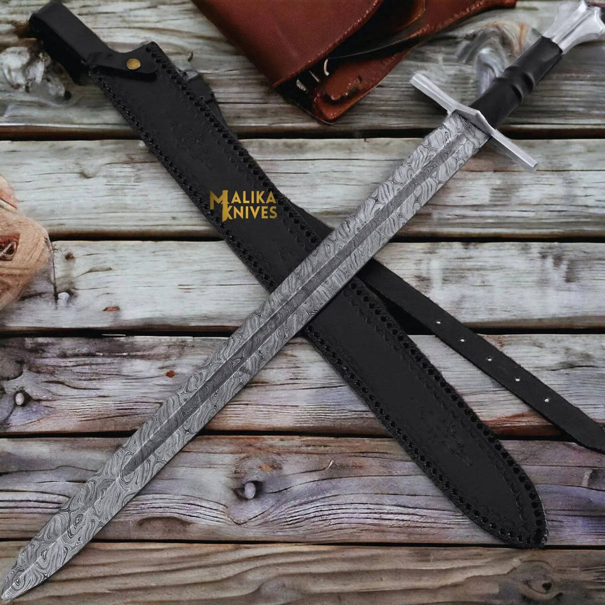 Handmade Medieval Damascus Templar Knight sword with leather sheath, featuring intricate blade patterns and detailed hilt by MALIKA KNIVES.