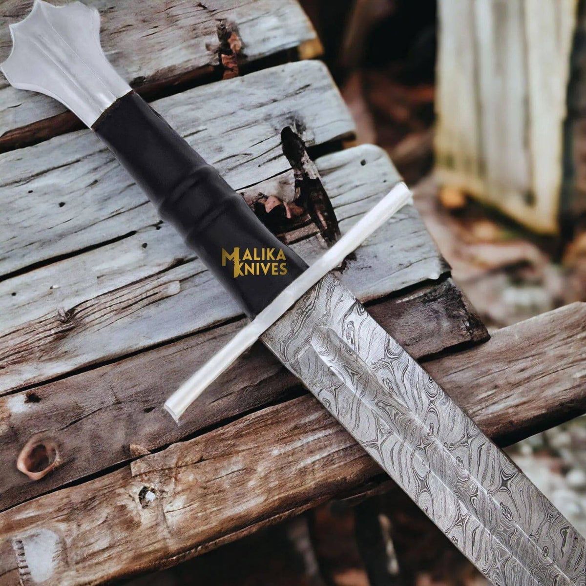 Handmade medieval Damascus Templar Knight sword with leather sheath by MALIKA KNIVES, featuring intricate blade patterns and a sturdy hilt.