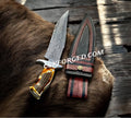 Handforged Damascus Steel 'Dragon Slayer' hunting knife by cskforged with stag handle, collector’s edition, detailed blade and handle features.