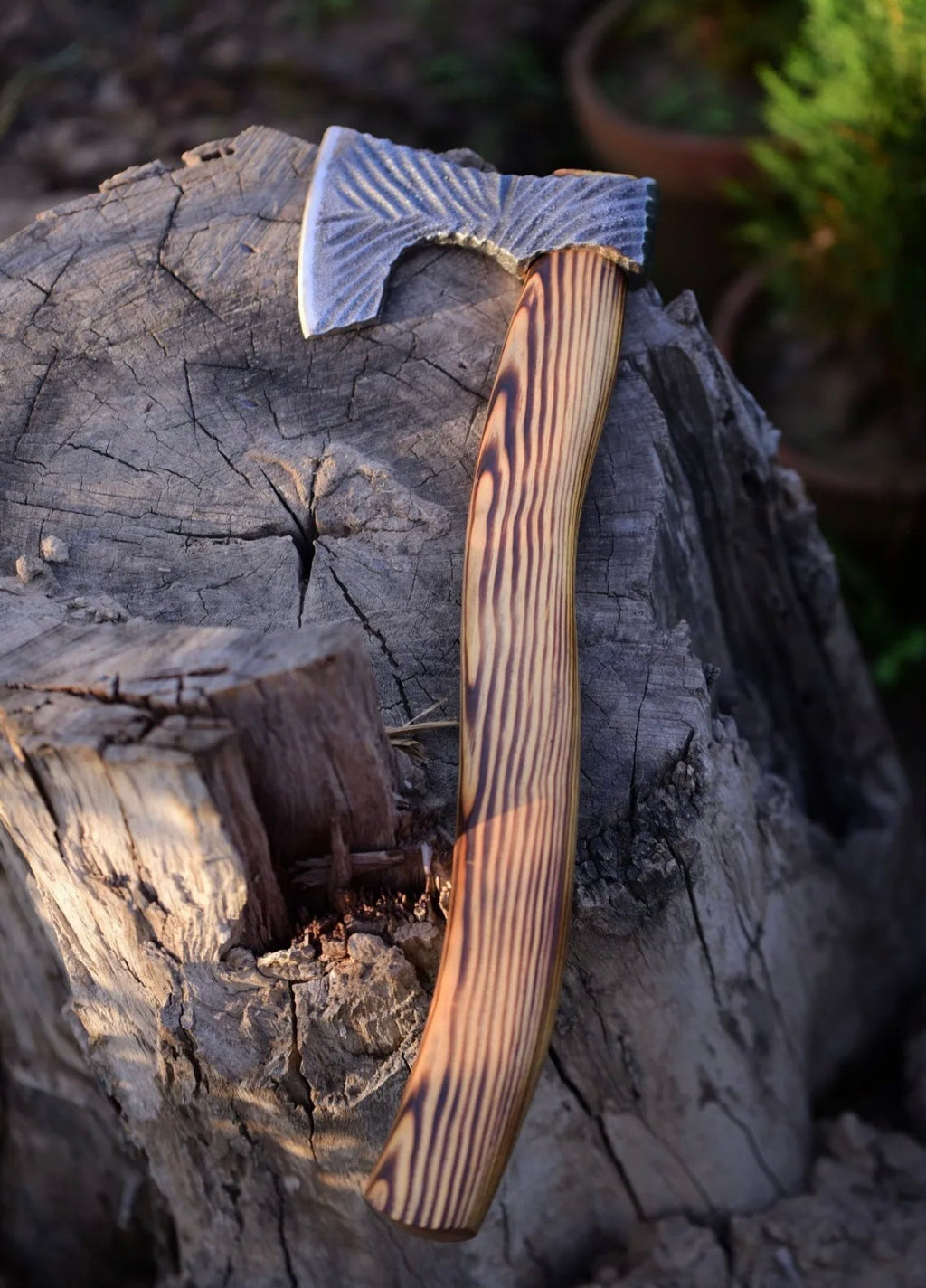 Handmade carbon steel Viking battle axe with wooden handle, featuring intricate blade design and sturdy craftsmanship.