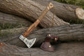 Handmade Viking axe hatchet with forged steel blade and wooden handle, suitable for splitting wood and outdoor use.