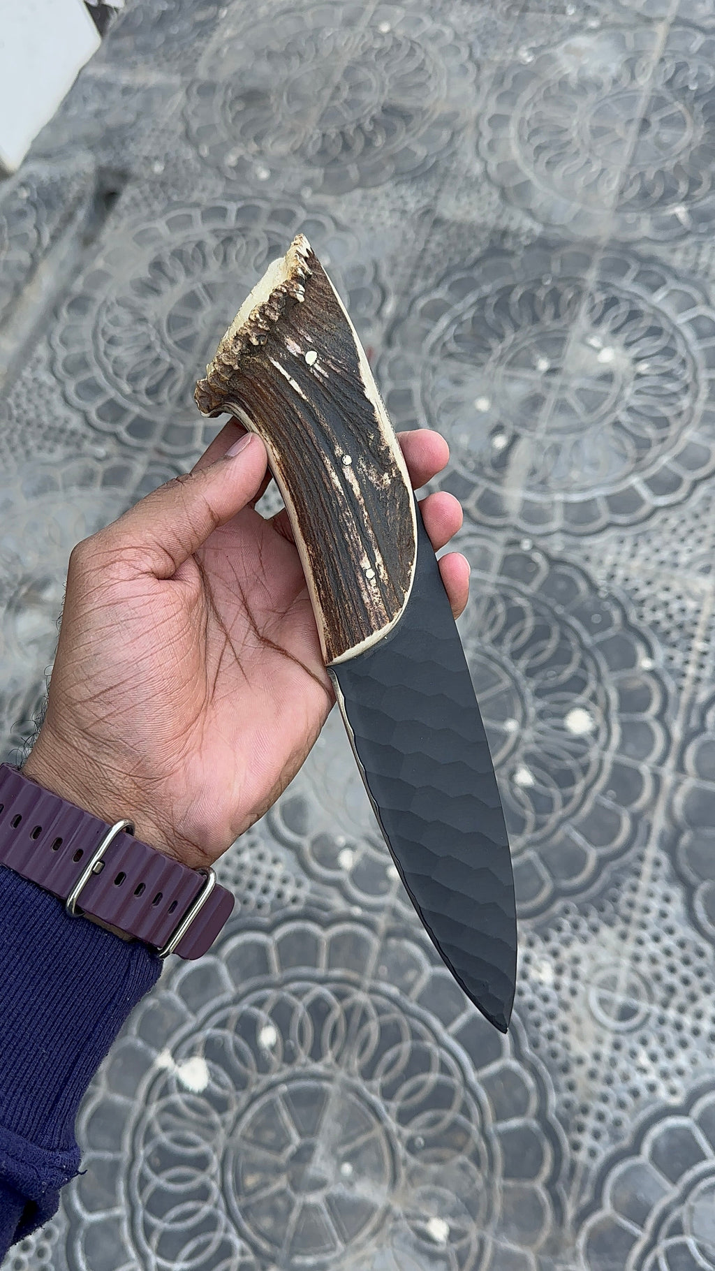 Hand forged steel hunting knife with wooden handle from Knives Gear Garage, showcasing a sharp blade and sturdy grip.