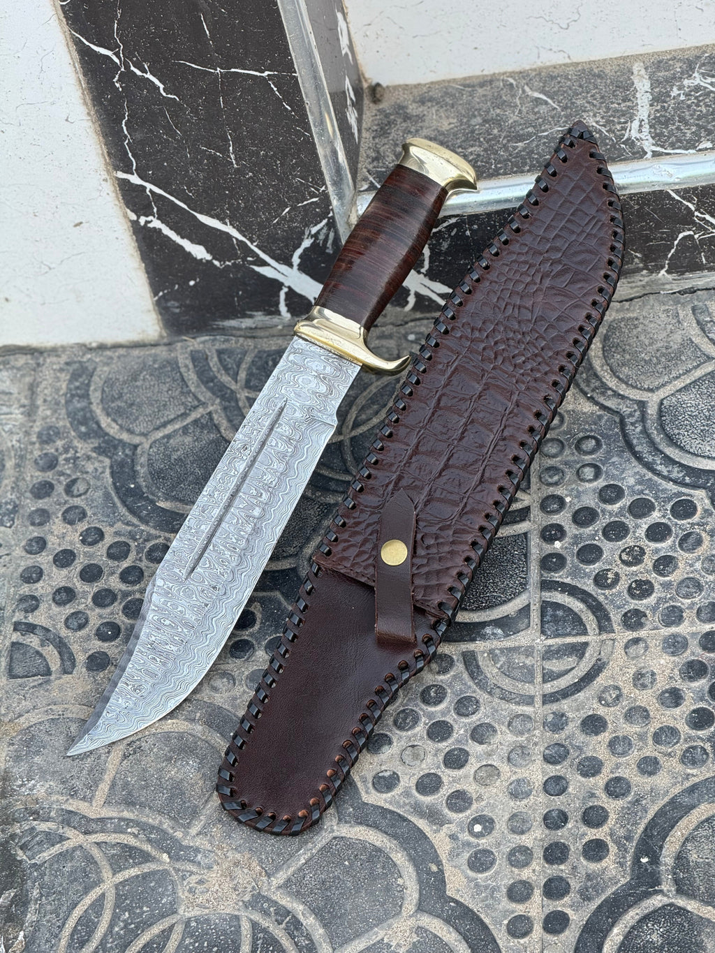 Handmade Damascus steel Crocodile Dundee Bowie knife with brass guard and leather handle, 16-inch length, by Knives Gear Garage.