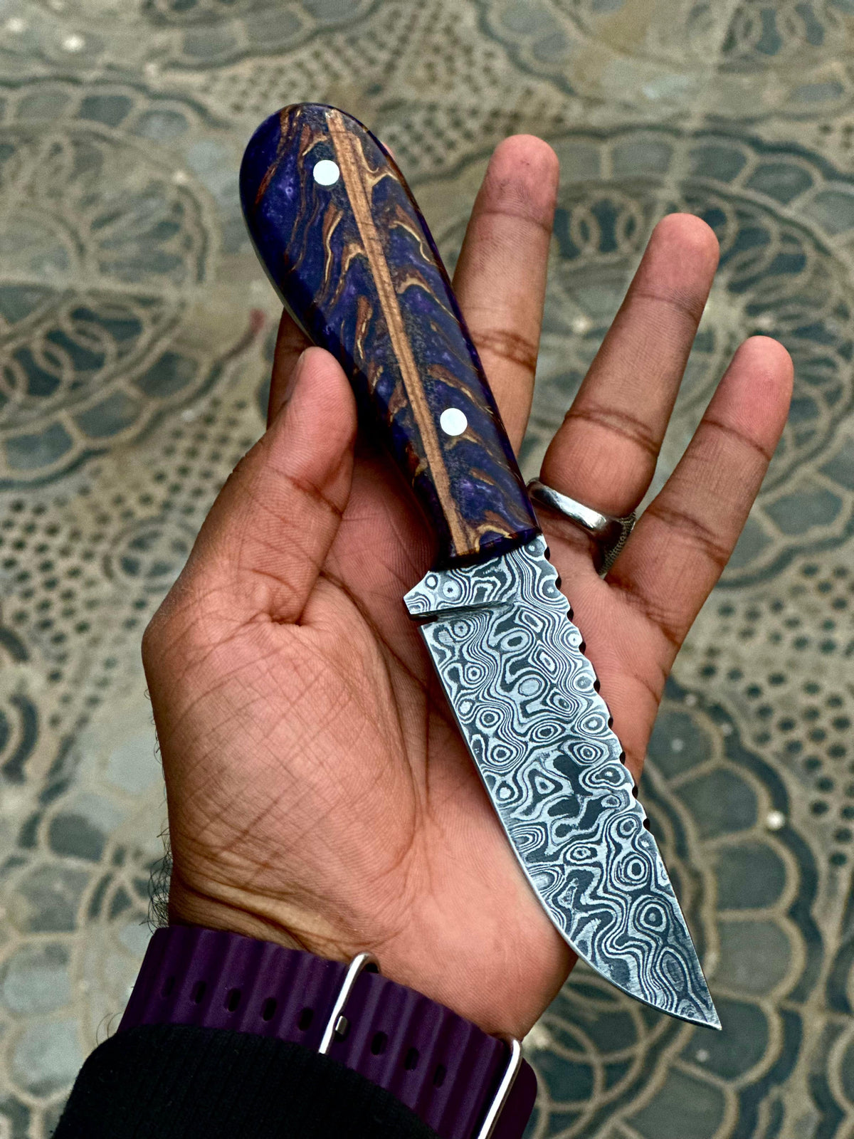 Handsome hunting knife from Knives Gear Garage with a sharp blade and textured handle for outdoor hunting and survival tasks.