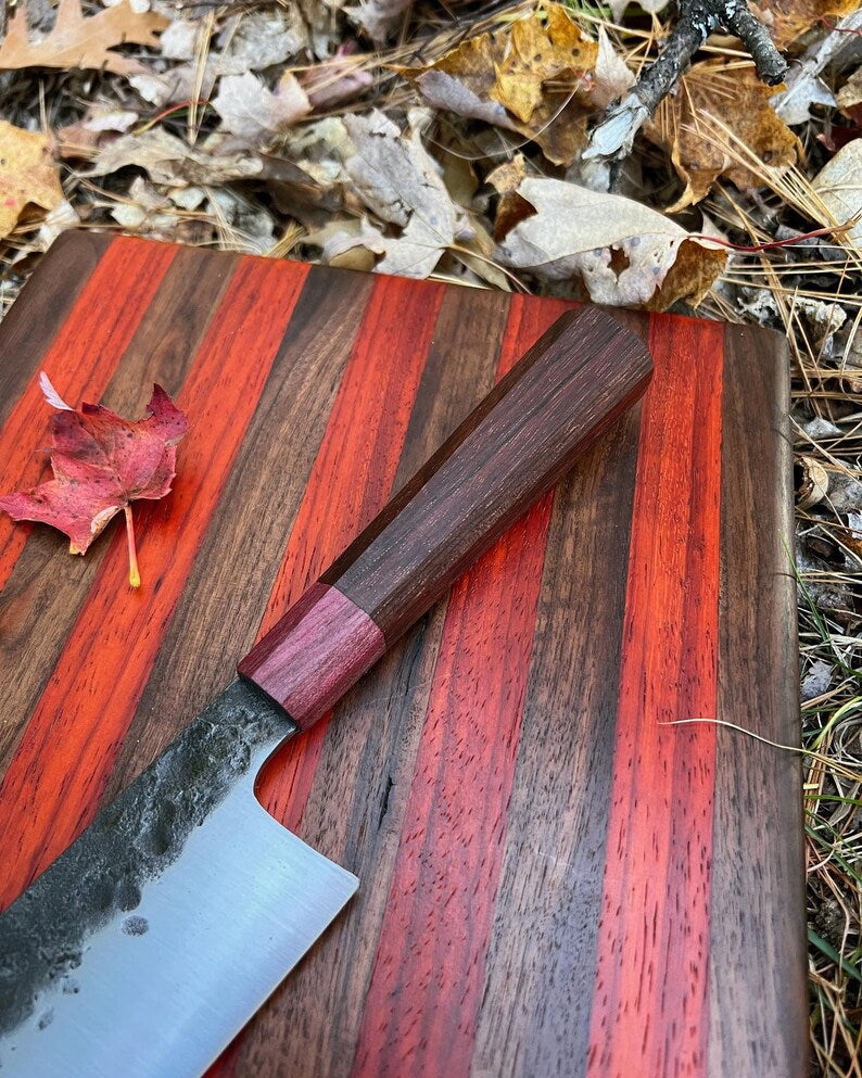 Lightweight chef knife from Knives Gear Garage with a sharp blade and ergonomic handle, ideal for precise kitchen prep.