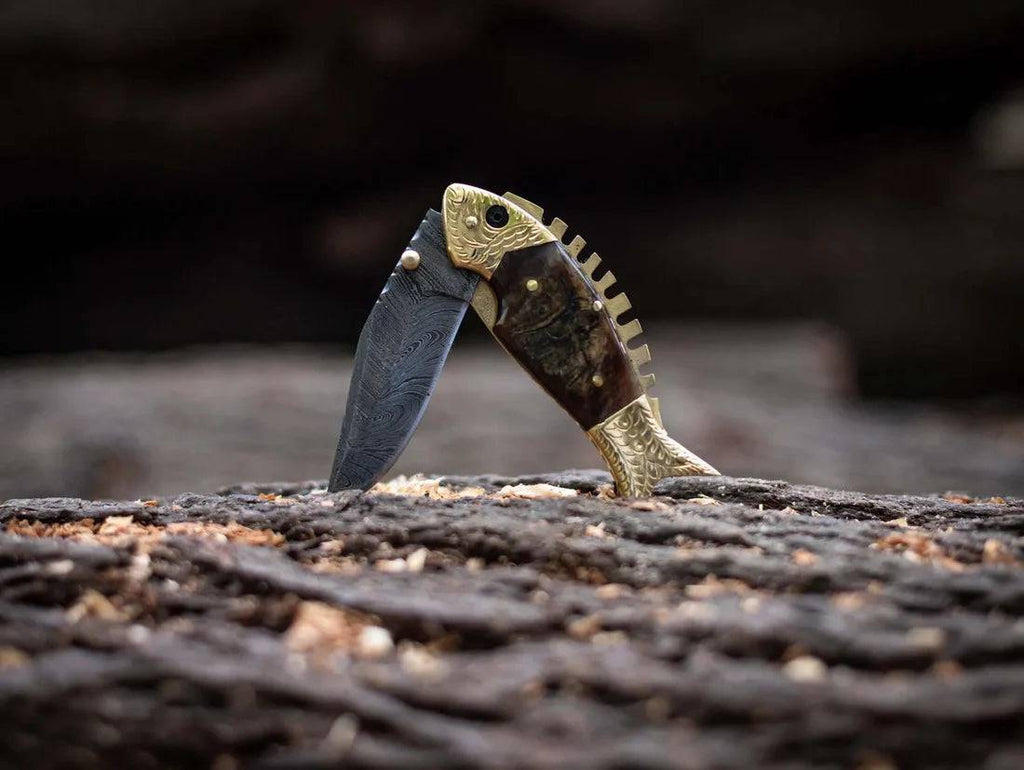 Damascus steel blade fish shape pocket folding knife by cskforged, showcasing intricate Damascus pattern and compact folding design.