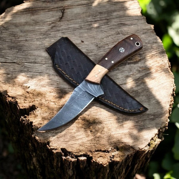 Handmade Damascus hunting knife with a polished rosewood handle and intricate blade pattern, ideal for outdoor and hunting use.