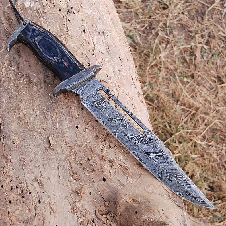 Custom handmade Damascus steel Rambo Bowie knife with brass wood handle and leather sheath from Knives Gear Garage.