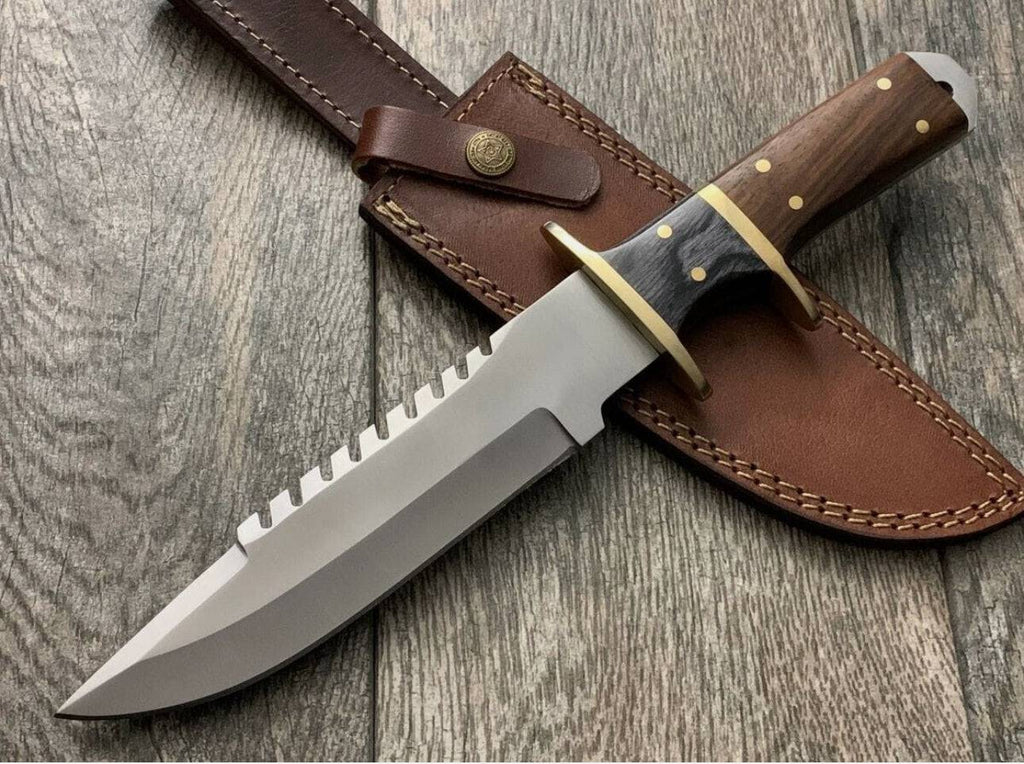 Handmade knife by cskforged with brass guard and rose wood handle, showcasing craftsmanship and detailed wood grain.