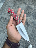 Handmade D2 steel hunting knife with custom handle by Knives Gear Garage, featuring a sharp blade and detailed craftsmanship.